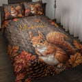 Squirrel quilt blanket spread on a bed with autumn leaves, pinecones, and rustic wood artwork
