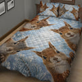 Close view of a squirrel quilt blanket with multiple expressive woodland squirrels on a blue background