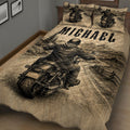 Close bedroom view of biker quilt blanket featuring a motorcycle rider traveling through a mountain landscape