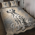 Dalmatian dog quilt blanket styled across a bedroom with coordinating dog artwork