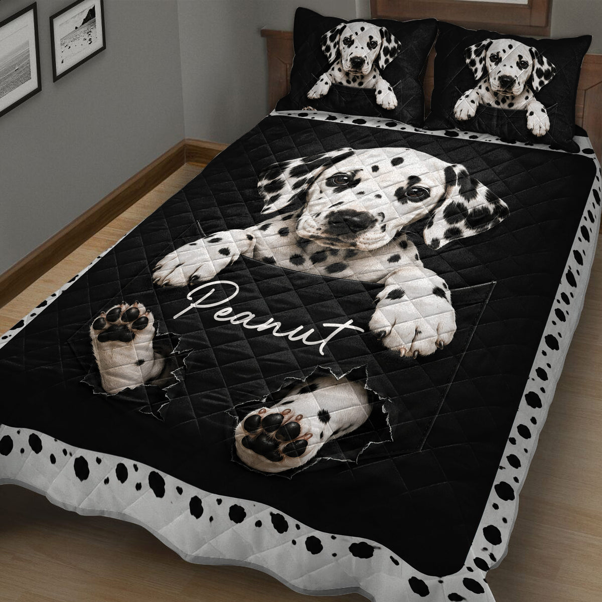 Close bedroom view of a black Dalmatian quilt blanket with spotted border and dog design