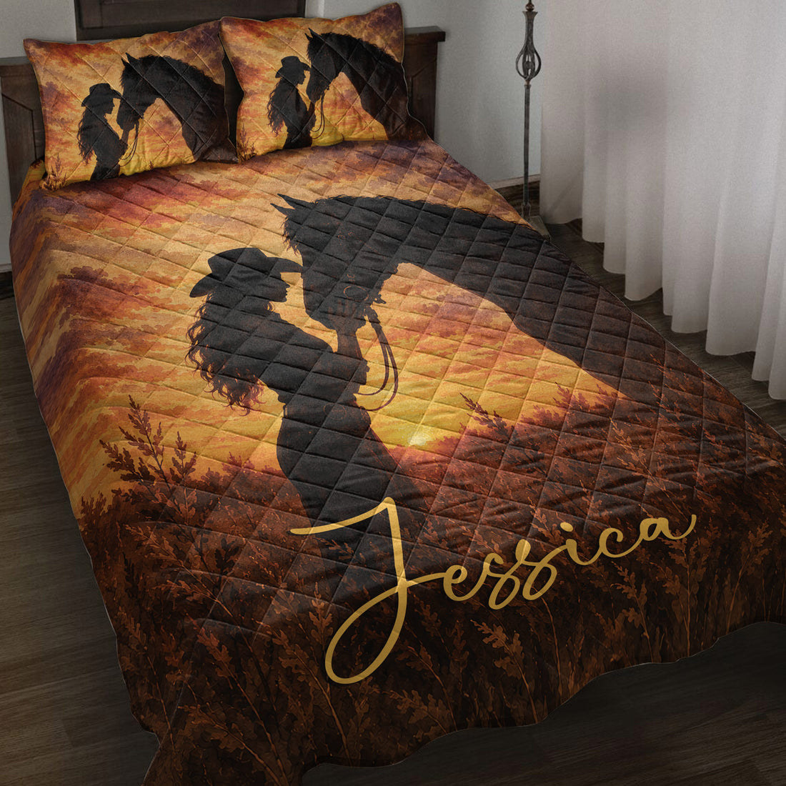 Cowgirl and black horse silhouette quilt blanket displayed on a bed with warm western sunset colors