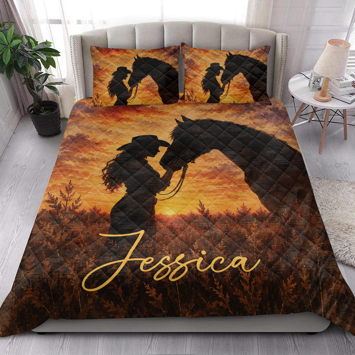 Cowgirl horse quilt blanket styled on a bright bedroom bed with western sunset artwork