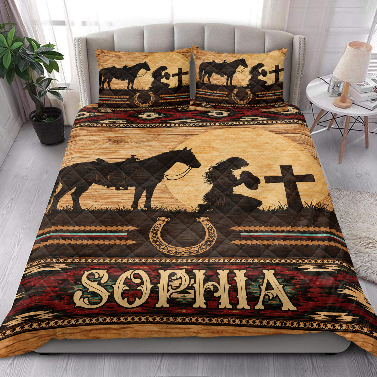 Cowgirl quilt bedding styled in a bright bedroom with horse silhouettes, horseshoes, and rustic Southwestern artwork