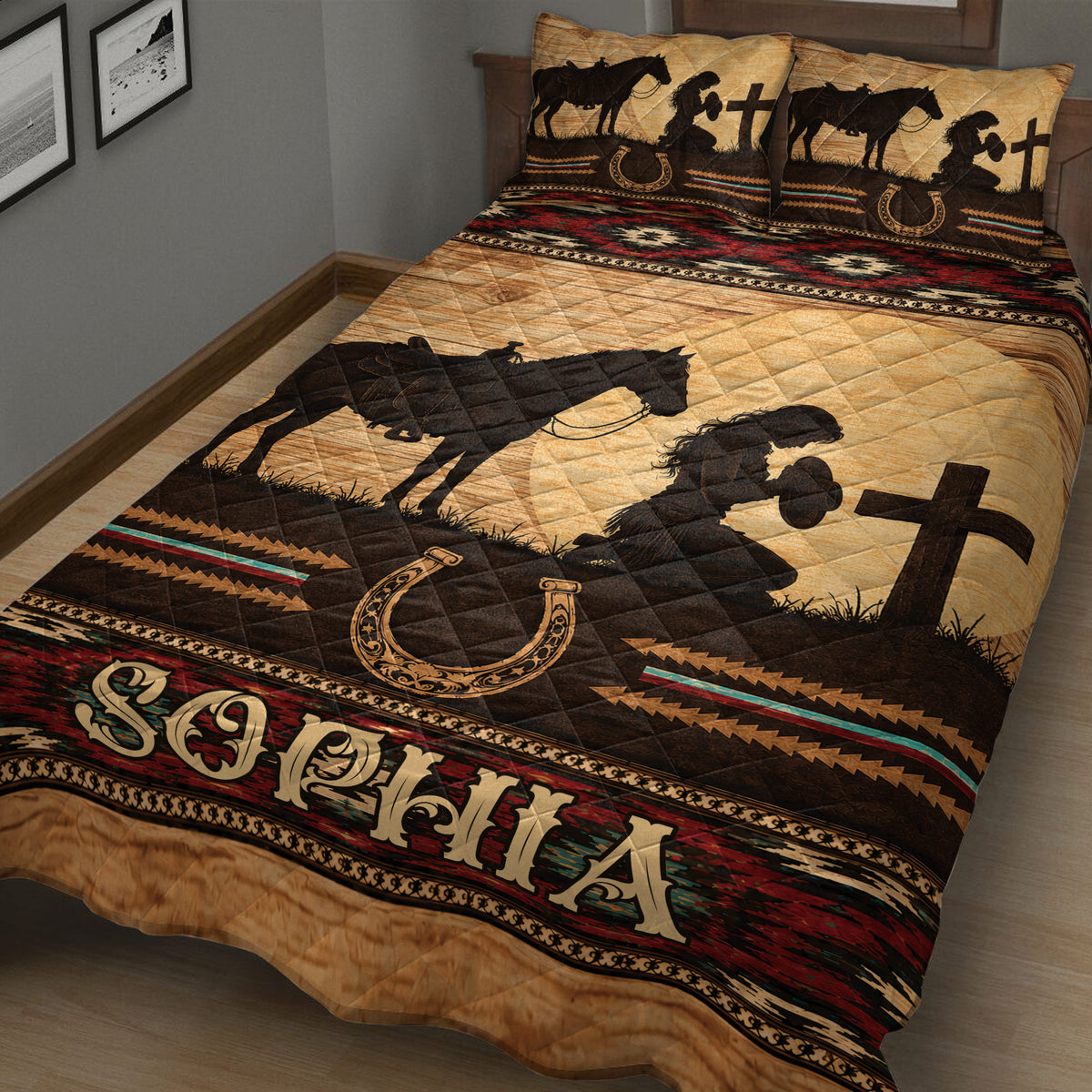 Close bedroom view of cowgirl quilt blanket featuring a saddled horse, western rider silhouette, horseshoe, and rustic patterns