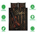 Violin quilt bedding set shown with rich black and copper artwork plus soft breathable and care icons