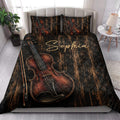 Violin quilt bedding set styled in a bright bedroom with bold black, copper, and red instrument artwork