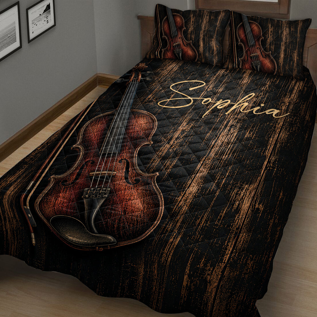 Close bedroom view of a black violin quilt blanket with large reddish-brown violin and bow artwork