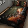 Close view of a violin quilt blanket with warm wood tones and dark green background