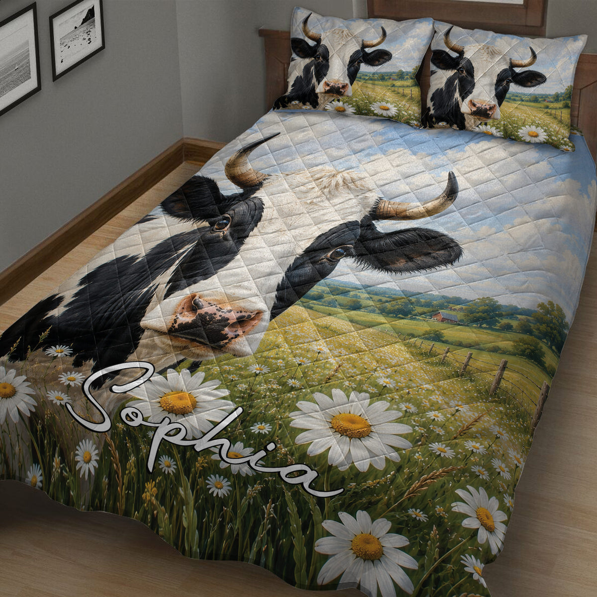 Dairy cow quilt blanket displayed on a bed with black-and-white cow artwork, daisies, and rolling farmland