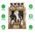 Front view of dairy cow quilt bedding with rustic barn artwork and soft breathable product feature icons