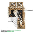 Dairy cow quilt blanket showing the printed front and white quilted polyester backing