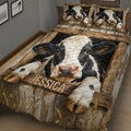 Close view of dairy cow quilt blanket with large black-and-white cow artwork and rustic farmhouse details