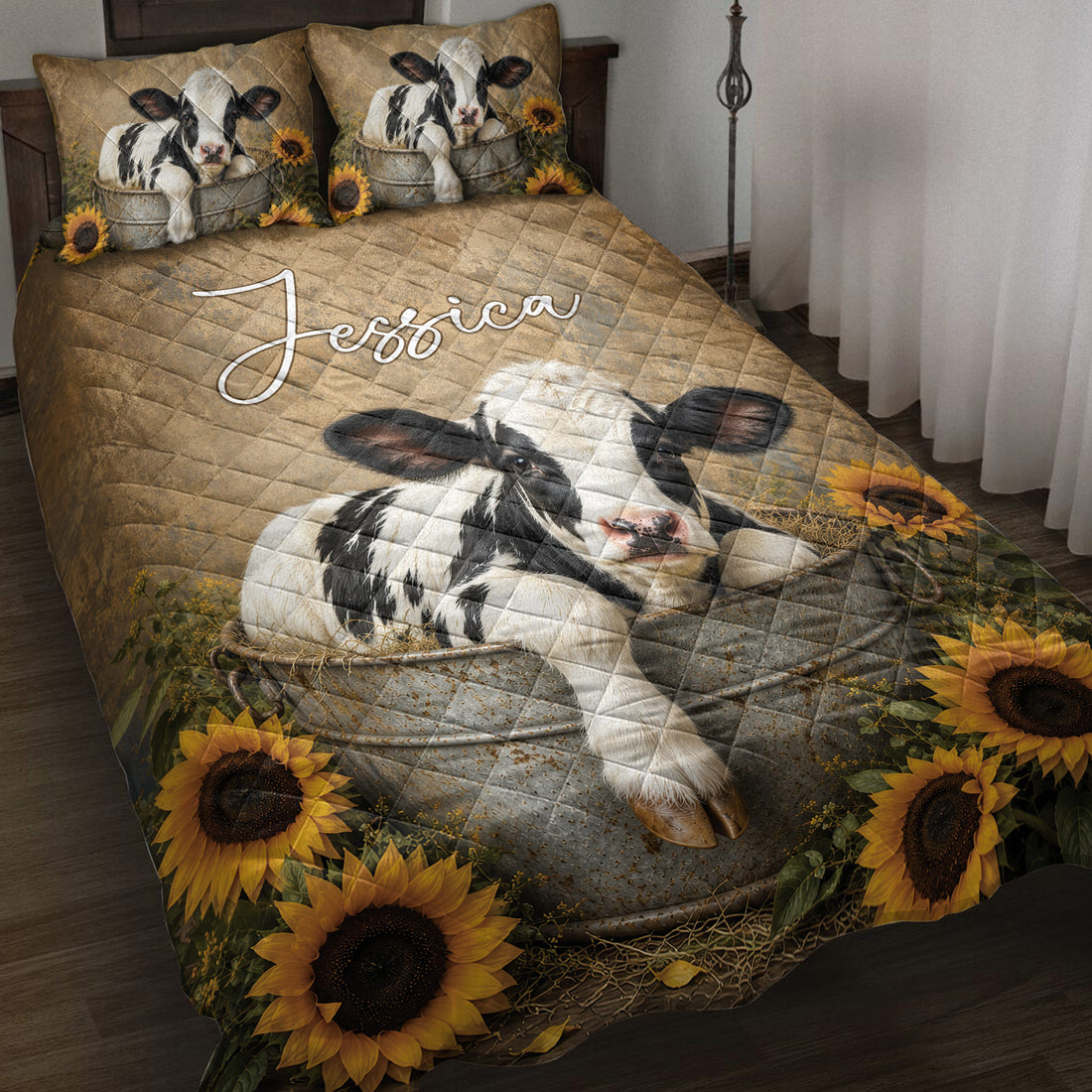 Dairy cow quilt blanket spread across a bed with sunflower borders and matching cow pillow artwork