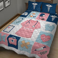 Close view of nurse quilt blanket featuring a pink scrub top, stethoscope, medical kit, clipboard, gloves, and supplies