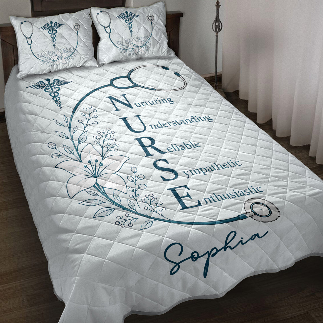 Nurse quilt blanket displayed on a bed with stethoscope, medical symbol, floral artwork, and inspirational lettering