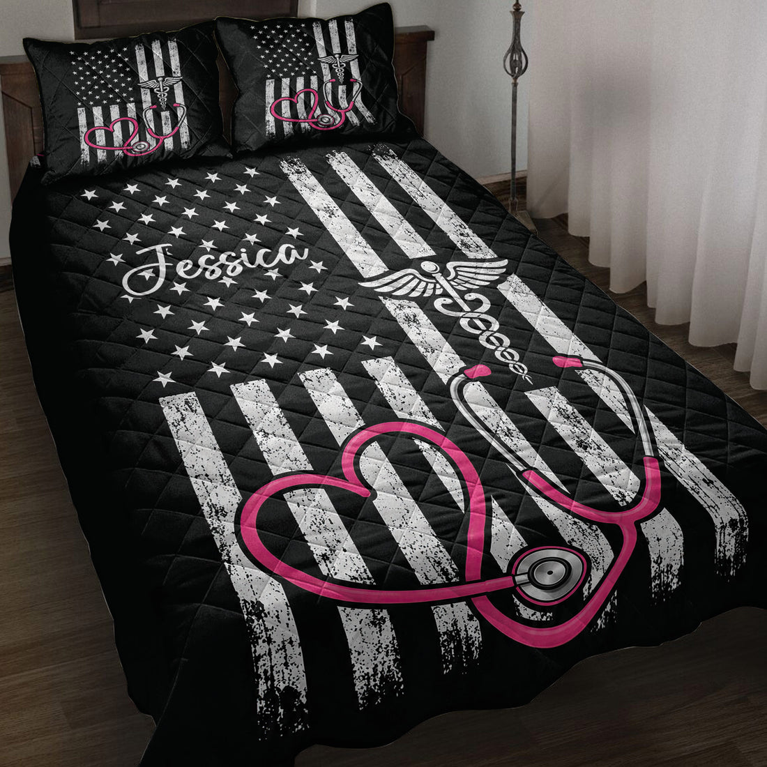 Black nurse quilt blanket on a bed with pink stethoscope artwork, stars, stripes, and medical symbols