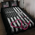 Black nurse quilt blanket on a bed with pink stethoscope artwork, stars, stripes, and medical symbols