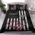 Nurse quilt blanket styled on a bright bedroom bed with patriotic stripes and pink stethoscope design