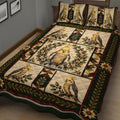 Vintage cockatiel quilt blanket displayed on a bed with floral branches, dark green borders, and bird panels