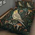 Close bedroom view of a cockatiel quilt blanket with flowers, leafy branches, and mushroom illustrations