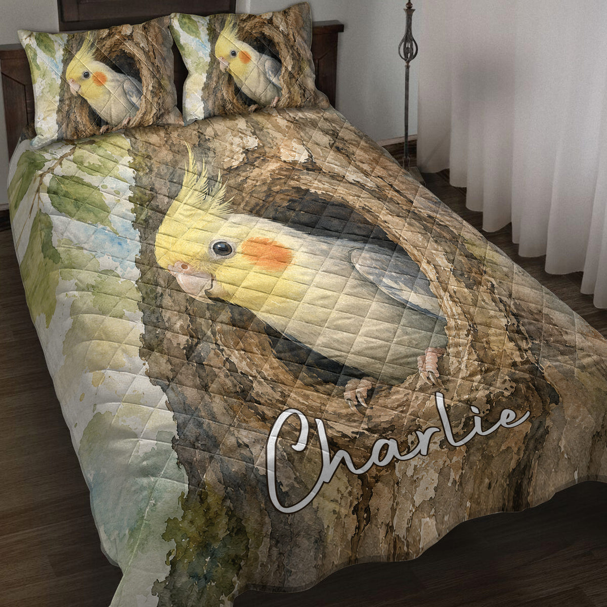 Cockatiel quilt blanket displayed on a bed with watercolor birds, tree branches, leaves, and earthy tones