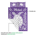Purple sea turtle quilt showing the printed front and white quilted backing detail