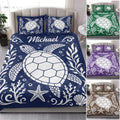 Sea turtle quilt bedding displayed in a bedroom with navy, green, purple, and brown color variations