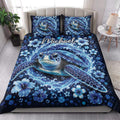 Sea turtle quilt blanket styled on a bright bedroom with matching ocean-themed pillows