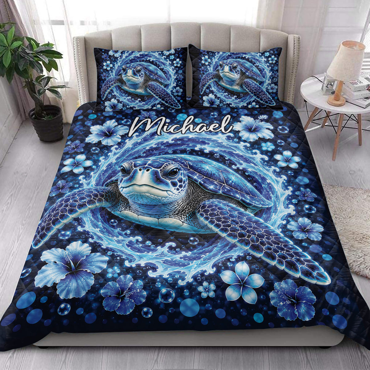 Sea turtle quilt blanket styled on a bright bedroom with matching ocean-themed pillows
