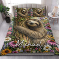 Sloth quilt bedding styled in a bright bedroom with floral woodland artwork