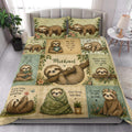 Sloth quilt bedding styled in a bright bedroom with leafy floral artwork and sleepy sloths across the bed