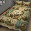 Close view of a sloth quilt blanket featuring woodland artwork, flowers, calming sayings, and a cozy bedroom setting