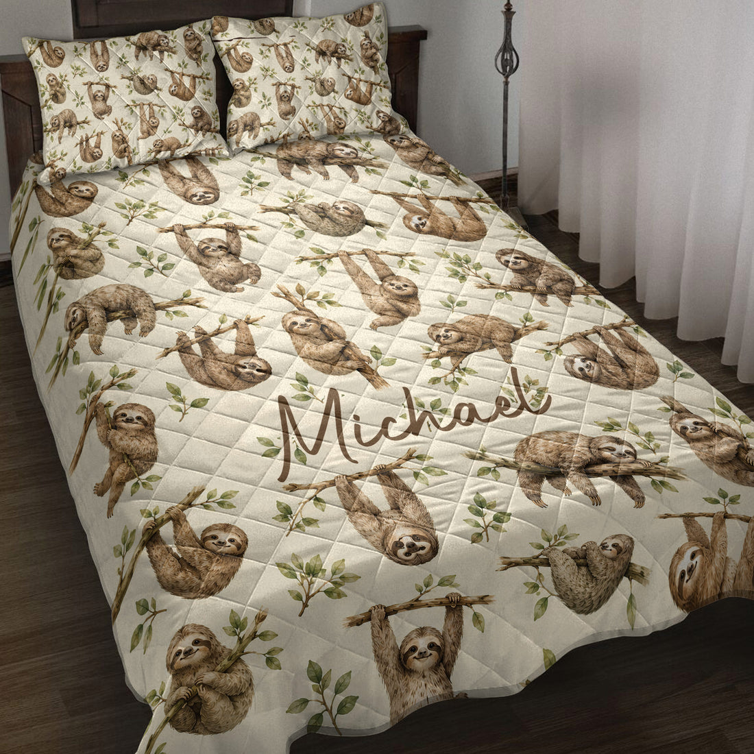 Sloth quilt blanket spread across a bed with leafy branches and earthy woodland artwork