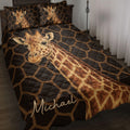 Giraffe quilt blanket bedding set styled on a bed with bold black and gold geometric artwork