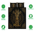 Black and gold giraffe quilt bedding set shown with ornate mandala artwork and care icons