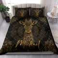 Black and gold giraffe quilt blanket styled in a bright bedroom with matching pillows