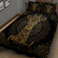 Ornate black and gold giraffe quilt blanket displayed across a bedroom with matching pillows