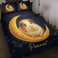 Guinea pig quilt blanket displayed on a bed with golden crescent moons, stars, and dark navy artwork