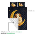 Guinea pig quilt showing the printed navy side and white diamond-quilted backing in a construction detail view