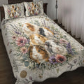Guinea pig quilt blanket displayed on a bed with floral artwork, paw prints, hearts, and botanical details