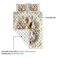 Guinea pig quilt blanket showing the printed floral front and plain white quilted reverse