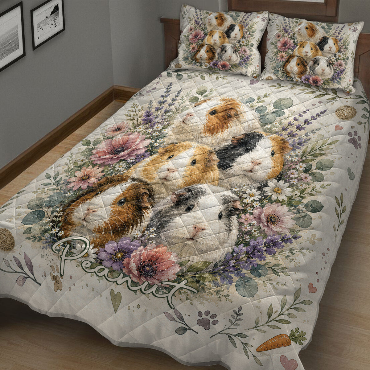 Close bedroom view of a guinea pig quilt blanket covered in colorful flowers, leaves, paw prints, and carrots