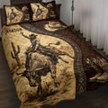 Rodeo quilt blanket displayed on a bed with bull rider, cowboy hat, boots, cactus, and Western artwork