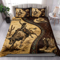 Rodeo quilt blanket styled in a bright bedroom with bull riding artwork, cactus, cowboy hat, and Western boots