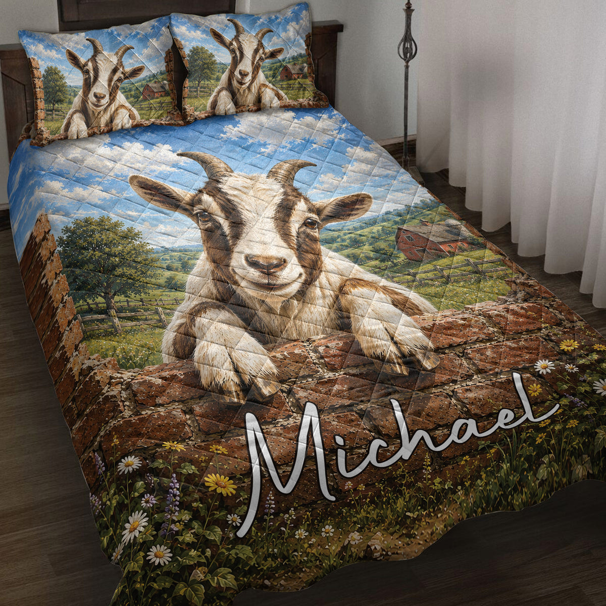 Goat quilt blanket displayed on a bed with countryside scenery, blue sky, barn, flowers, and farmhouse artwork
