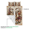 Goat quilt showing the printed floral side and white diamond-quilted reverse