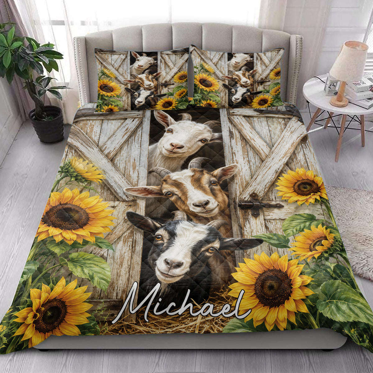 Goat quilt blanket styled on a bedroom bed with rustic barn doors, goats, and bright sunflowers
