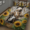 Angled bedroom view of a goat quilt blanket with sunflower borders and rustic farmhouse artwork