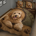 Close bedroom view of Labradoodle quilt bedding with warm brown tones, paw prints, and dog artwork
